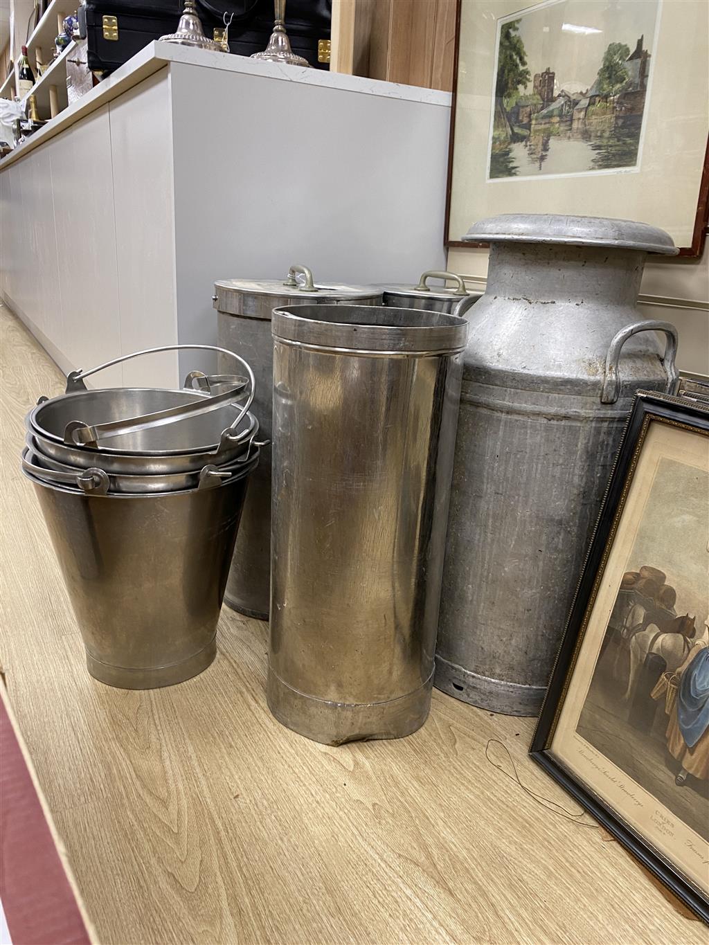 Three stainless steel cylindrical food containers, a galvanised steel churn and four stainless steel buckets